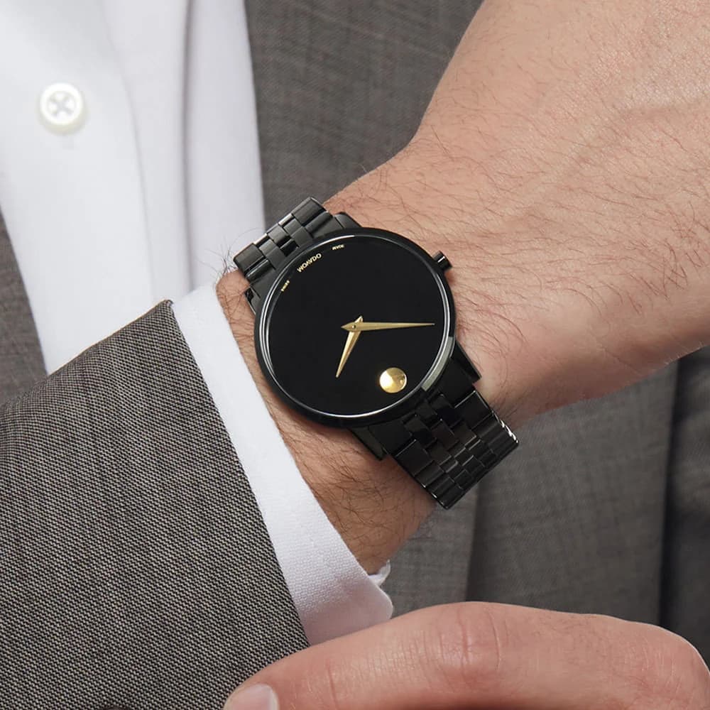 Black Movado Museum Classic worn with a grey suit