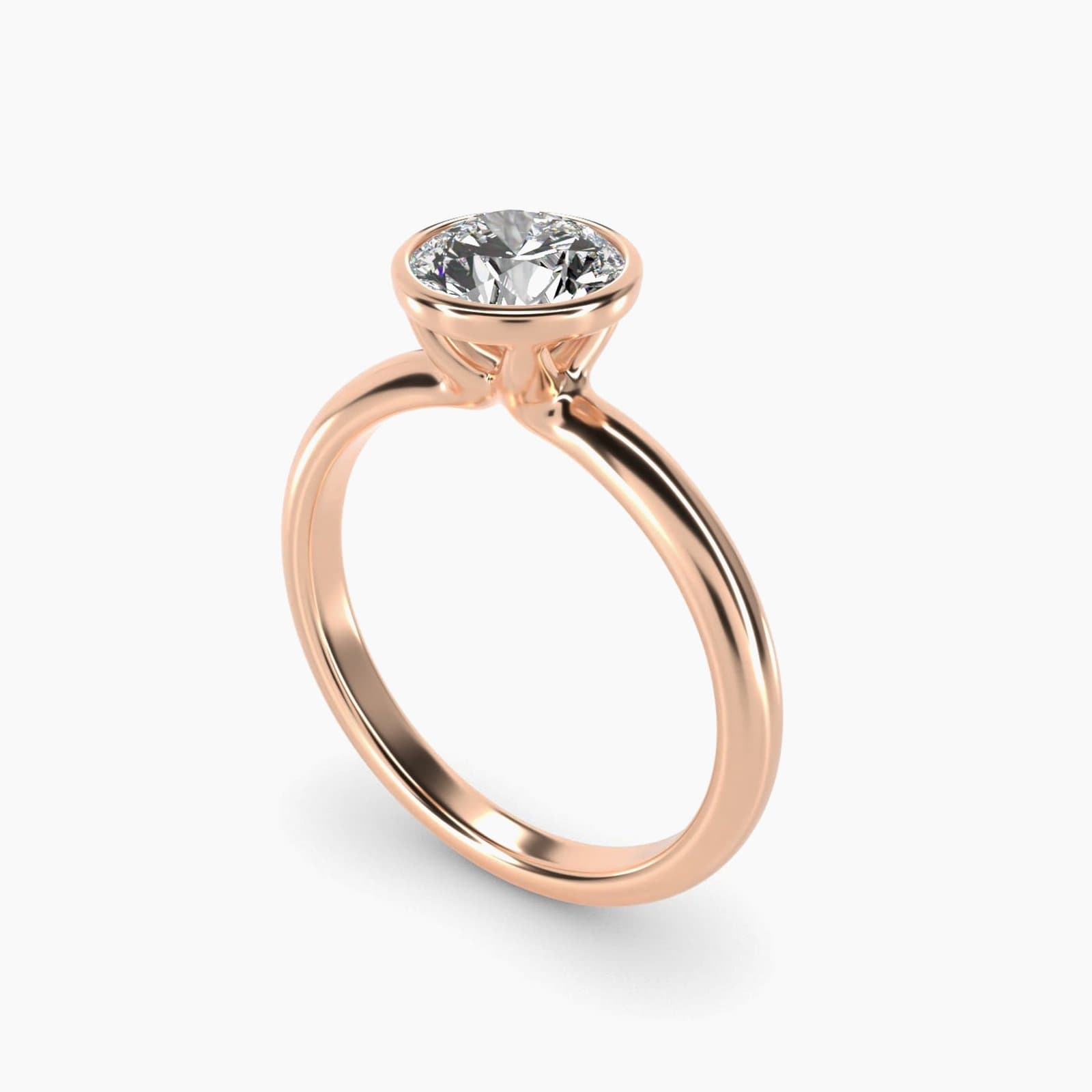 Bezel set solitaire engagement ring in rose gold