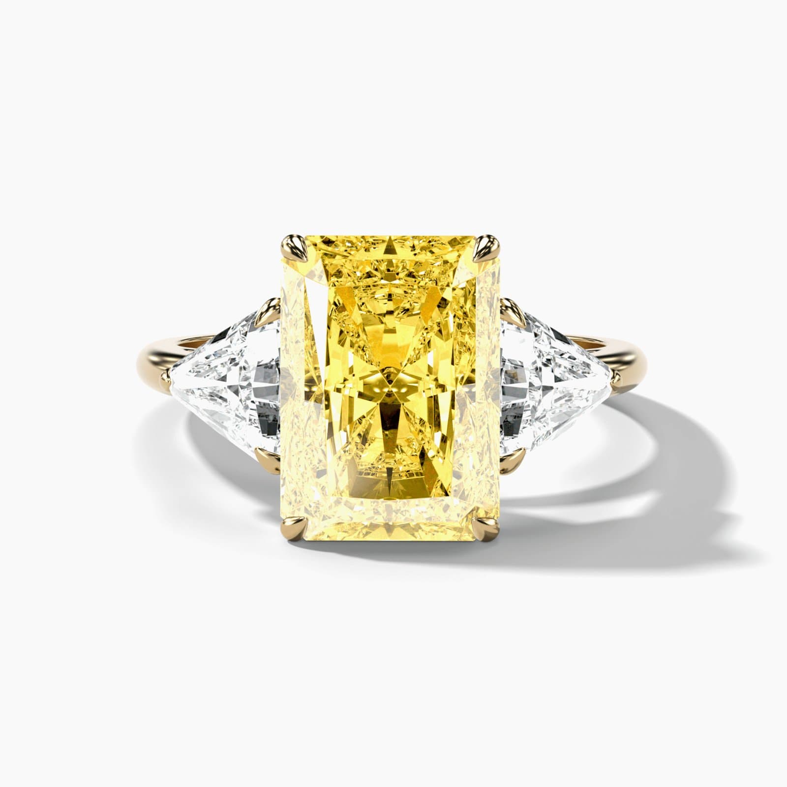 Canary yellow radiant three stone engagement ring in yellow gold