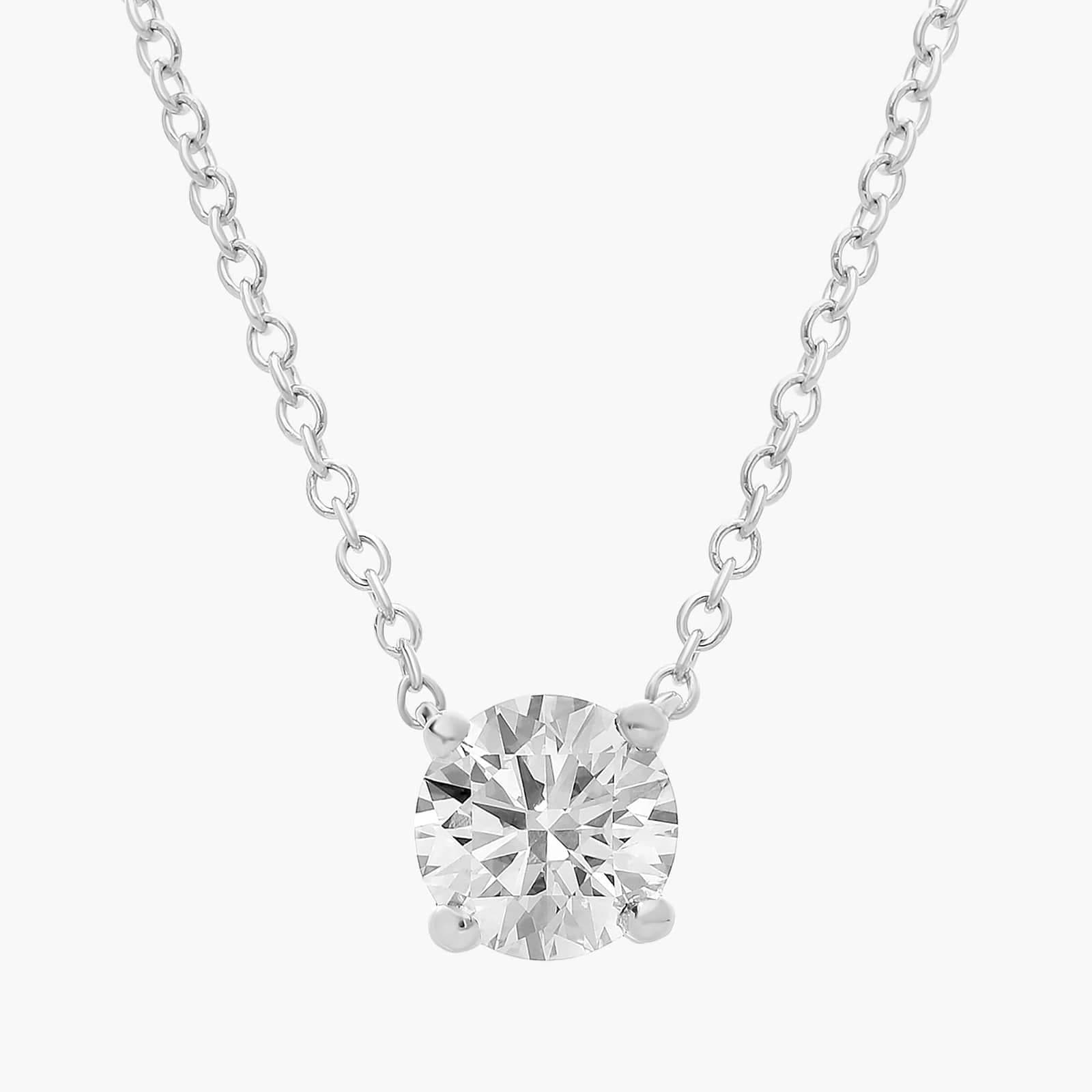 Four prong solitaire diamond pendant in 14K white gold