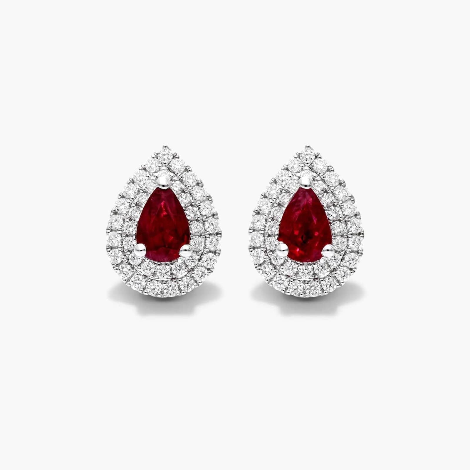 Pear ruby and diamond double halo earrings in 18K white gold